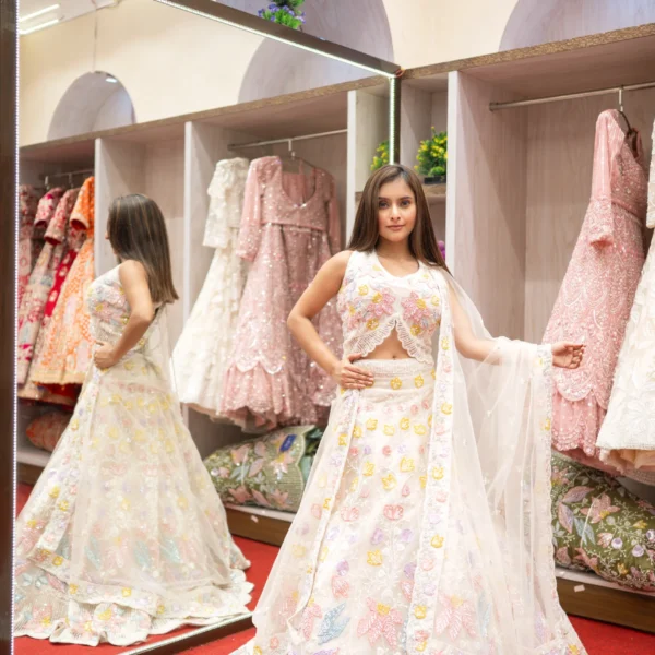 Cream Net Designer Lehenga with Readymade Sleeveless Blouse